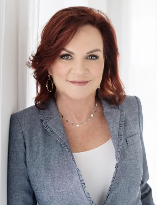 Diane Torres, VP of Community Impact at Brickwell Housing, warm professional headshot