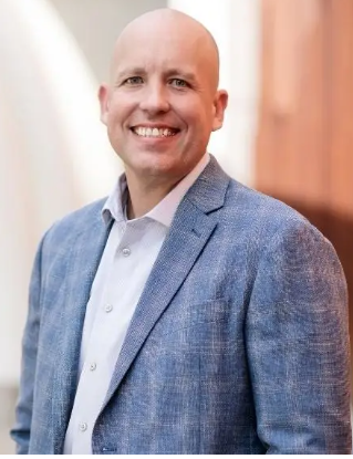 Mark Logan, Chief Development Officer of Brickwell Housing, professional headshot
